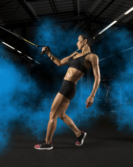 Fototapeta na wymiar Woman exercising building muscles