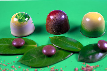 Top view of set of beautiful and delicious chocolate sweets decorated with assorted chocolate crumbs