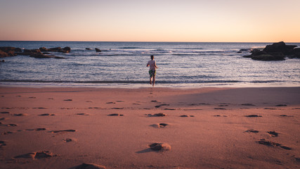 man running in the ocean 2 © Lars Junker