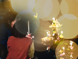 Fototapeta premium thai people pray and hold hand made krathong by flower from loykratong festival and thailand culture on november