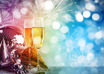 Two champagne glasses against New Year