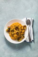 risotto with pumpkin and brussels sprouts on the table. A healthy recipe for the whole family. festive table