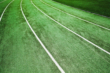 Empty running track with artificial turf