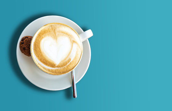 Directly Above Shot Of Cup Of Cappuccino On Blue Background