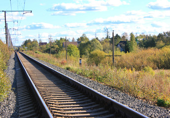 Obraz na płótnie Canvas Railroad Train Track Industrial Transportation Perspective Background. Passenger Train Rail Road at Autumn Trees Nature. Commuter Train Railway Station, Rural Industrial Landscape with Train Track