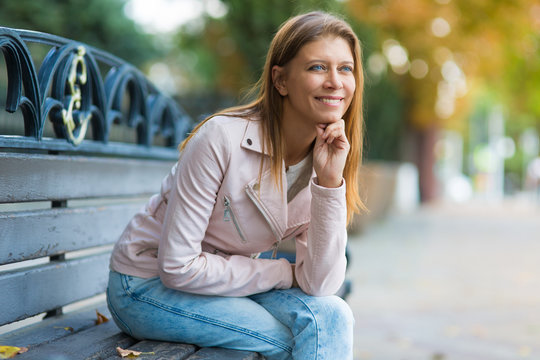 Woman 30 Years Old Walking In The City On A Sunny Day