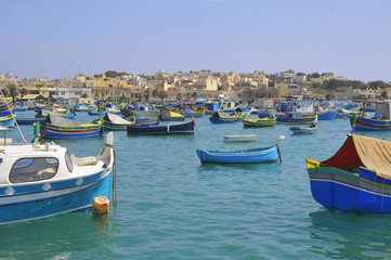 Fototapeta na wymiar Marsaxlokk - a traditional fishing village in the South Eastern Region of Malta