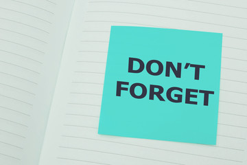 "Don't forget" on blue sticky note