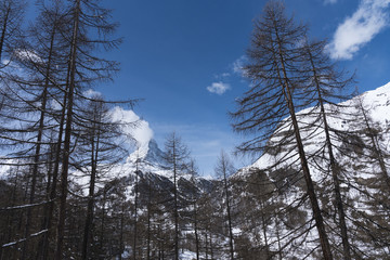 The famous mountain Matterhorn peak with cloudy and blue sky from Gornergrat, Zermatt, Switzerland