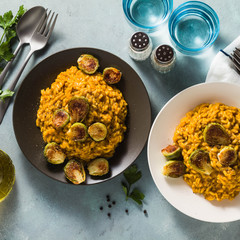 risotto with pumpkin and brussels sprouts on the table. A healthy recipe for the whole family. festive table