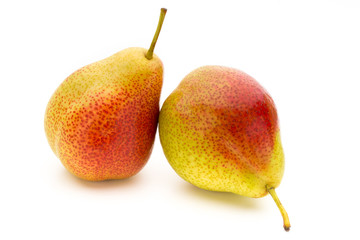 Fresh bio pear with leaves on isolated white background.