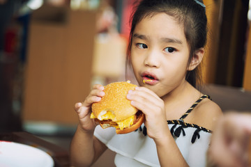 asian Children eat chicken cheese Hamburger Food Court