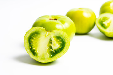 Green tomato on white background