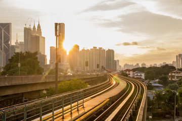 Fototapeta premium Railway tracks lead to the business and finance centre of Kuala Lumpur
