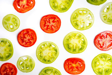 Green tomato slices on white background