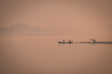 Fototapeta na wymiar At dawn on the river
