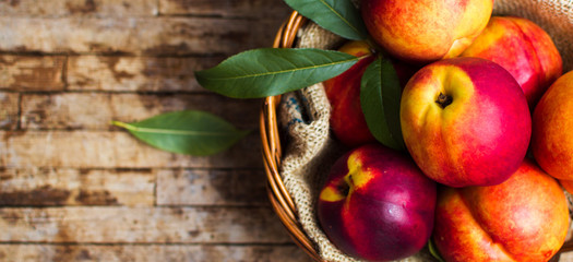 Peaches on a rustic wooden background