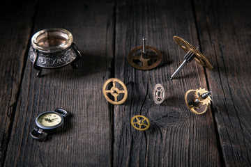 Clockwork gears of time bronze on wooden table. Concept  time and ideas support