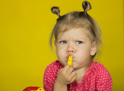 Cute Child Blowing The Whistle