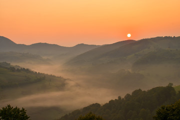 Beautiful from the nature with fog and clouds at sunrise