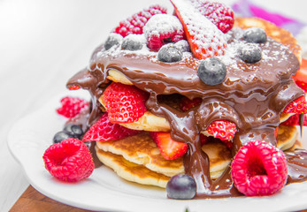 pancakes with chocolate and fresh berries