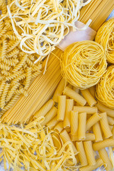 Fresh raw pasta from whole grain flour. Spaghetti, egg noodles, tortiglioni, fusilli and nests. The view from the top