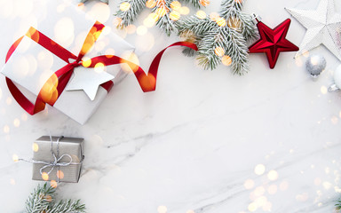 Christmas and New Year holiday background. Xmas greeting card. Christmas gifts on white marble...