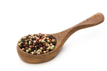 Pepper mix seed on spoon on white background.