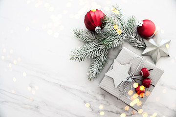 Christmas and New Year holiday background. Xmas greeting card. Christmas gifts on white marble background top view. Flat lay