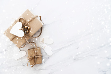 Christmas and New Year holiday background. Xmas greeting card. Christmas gifts on white marble...