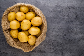 A bio russet potato wooden vintage background.