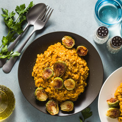 risotto with pumpkin and brussels sprouts on the table. A healthy recipe for the whole family. festive table