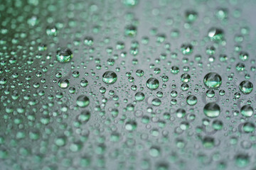 rain drops on car glass with hydrophobic coating macro photo