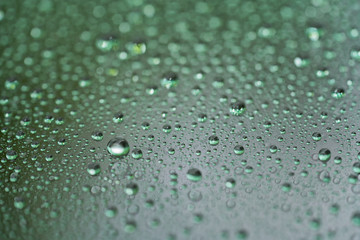 Closeup rain drops on car glass with hydrophobic coating