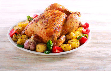 Whole roast spicy chicken with potatoes