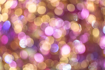 Background texture full of unsharp golden and pink shining bokeh blurring gradation design.