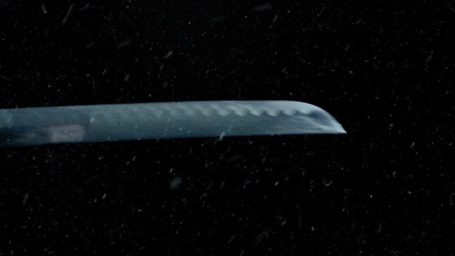 Samurai Sword Unsheathed With Snow Falling