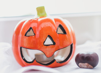 Halloween ceramic pumpkin. Home made decoration to the apartment.