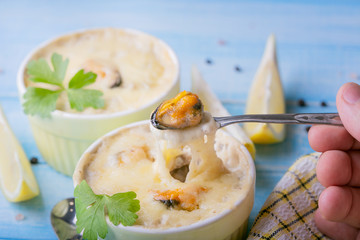 Julienne with champignons and mussels, closeup
