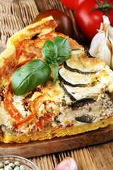 Homemade Cheesy Egg Quiche for Brunch with Spinach and Tomato, onions and zucchini.