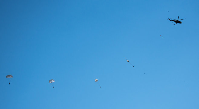 against the blue sky jumping skydiver on