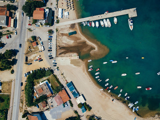 Landscape with boats in marina bay. Top view of harbor with sailboat.