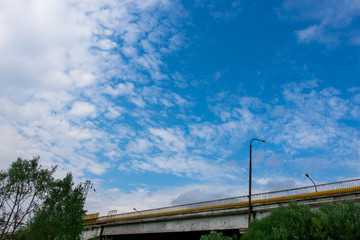 Obraz premium car bridge against the blue sky with clouds