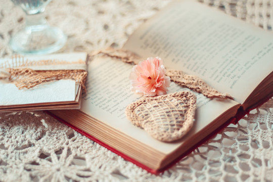 Delicate composition with old books decorated in rustic style