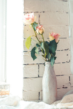 Delicate composition with flowers in a vase