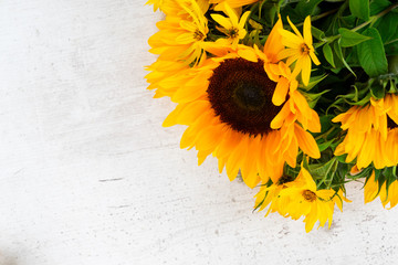 Sunflowers fresh flowers on white wooden table background