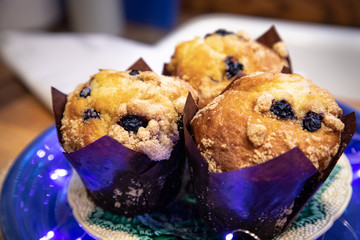Three Blueberry Muffins on a Plate