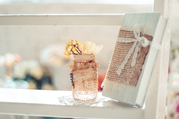 Delicate composition with flowers in a vase