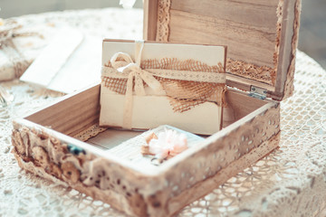 Fototapeta na wymiar Delicate composition with letters in a box decorated in rustic s