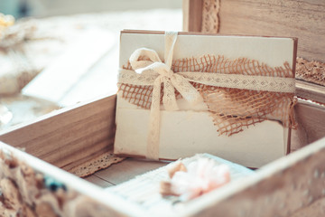 Delicate composition with letters in a box decorated in rustic s